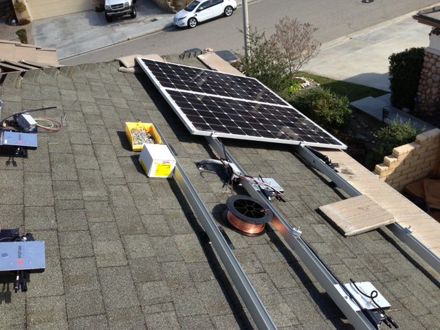 Home Solar System For Ev Racking System Showing A Pair Of Panels Enphase Micro Inverters And Copper Bonding Wire The Roof Received New Composite Roofing Concrete Tiles